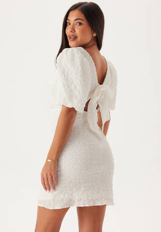 structured short white dress Bold strapless mini dresses featuring structured floral textures